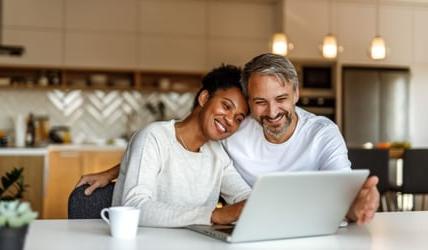 Couple looking over earnings from high-yield account